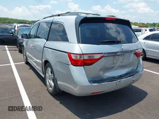 2011 Honda Odyssey Touring with VIN 5FNRL5H99BB058448, listed as a IAAI auction lot 42651432 with 208,581 mi miles and . Bid and sale history available at DreamBid. Image 3.