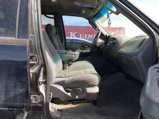 2003 Ford F-150 XLT with VIN 1FTRW08L83KA14760, listed as a IAAI auction lot 41820943 with 215,130 mi miles. Bid and sale history available at carsss.com. Image 5.