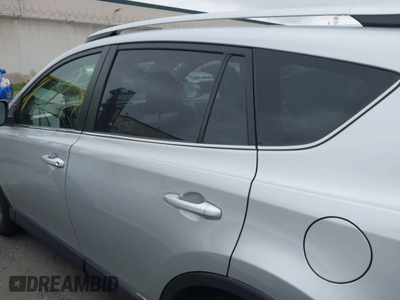 2016 Toyota RAV4 Hybrid XLE with VIN JTMRJREVXGD029019, listed as a IAAI auction lot 42021530 with 74,400 mi miles. Bid and sale history available at carsss.com. Image 15.