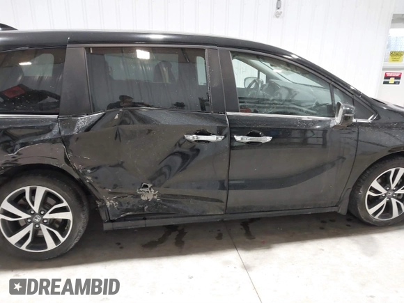 2023 Honda Odyssey Touring z VIN 5FNRL6H85PB039450, wystawiony jako IAAI lot #41504351 z przebiegiem 51 000 mil mil oraz . Historia ofert i sprzedaży dostępna na DreamBid. Obrazek 13.