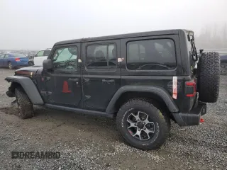 2021 Jeep Wrangler Unlimited Rubicon with VIN 1C4JJXFM7MW818199, listed as a Copart auction lot 87428474 with 18,696 mi miles and Salvage Title. Bid and sale history available at carsss.com. Image 2.