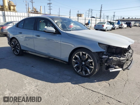 2024 BMW 5 Series 530i with VIN WBA43FJ06RCP67824, listed as a Copart auction lot 61351965 with 12,990 mi miles and Salvage title. Bid and sale history available at DreamBid. Image 4.