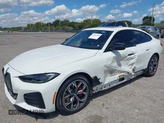 2024 BMW i4 eDrive35 z VIN WBY43AW02RFS79370, wystawiony jako IAAI lot #41887964 z przebiegiem 11 910 mil mil oraz . Historia ofert i sprzedaży dostępna na DreamBid. Obrazek 2.