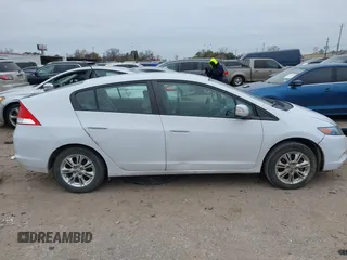 2010 Honda Insight EX with VIN JHMZE2H71AS035091, listed as a IAAI auction lot 41380128 with 181,653 mi miles and . Bid and sale history available at DreamBid. Image 14.