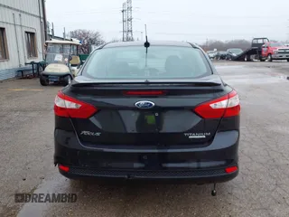 2014 Ford Focus Titanium with VIN 1FADP3J25EL310199, listed as a IAAI auction lot 40682901 with 84,885 mi miles and . Bid and sale history available at DreamBid. Image 14.