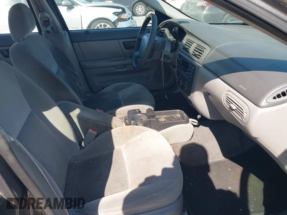 2005 Ford Taurus SE with VIN 1FAFP53U95A289971, listed as a IAAI auction lot 42143134 with 167,702 mi miles. Bid and sale history available at carsss.com. Image 5.