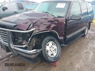 1997 GMC Yukon with VIN 1GKEK13R0VJ755574, listed as a IAAI auction lot 41158932 with 212,668 mi miles. Bid and sale history available at carsss.com. Image 6.