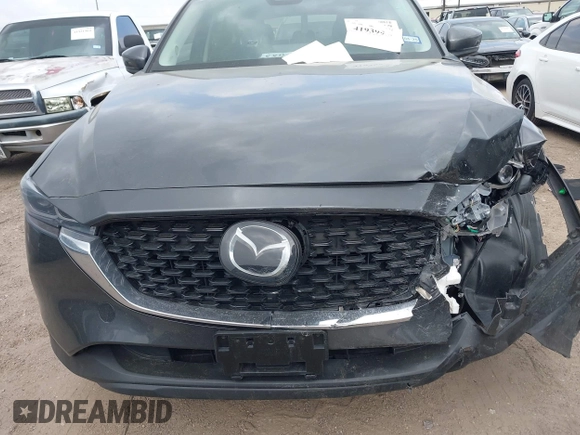 2023 Mazda CX-5 S Carbon Edition z VIN JM3KFBCM7P0226930, wystawiony jako IAAI lot #41939956 z przebiegiem 29 477 mil mil oraz . Historia ofert i sprzedaży dostępna na DreamBid. Obrazek 12.