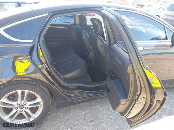 2015 Ford Fusion Titanium Hybrid with VIN 3FA6P0RUXFR119698, listed as a IAAI auction lot 41791411 with 140,646 mi miles. Bid and sale history available at carsss.com. Image 8.