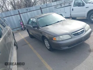 2001 Mazda 626 LX with VIN 1YVGF22C815218444, listed as a IAAI auction lot 41940404 with 143,080 mi miles. Bid and sale history available at carsss.com. Image 1.