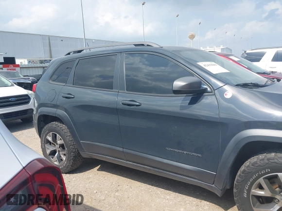 2016 Jeep Cherokee Trailhawk z VIN 1C4PJMBS0GW300131, wystawiony jako IAAI lot #42439009 z przebiegiem 173 571 mil mil oraz . Historia ofert i sprzedaży dostępna na DreamBid. Obrazek 13.