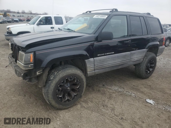 1998 Jeep Grand Cherokee Laredo with VIN 1J4GZ58S2WC281923, listed as a Copart auction lot 44010885 with 210,959 mi miles and Salvage Title. Bid and sale history available at carsss.com. Image 1.