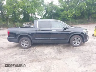 2023 Honda Ridgeline RTL-E with VIN 5FPYK3F77PB052828, listed as a IAAI auction lot 42366947 with 24,658 mi miles and . Bid and sale history available at DreamBid. Image 13.