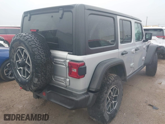 2024 Jeep Wrangler Rubicon with VIN 1C4PJXFG7RW252959, listed as a IAAI auction lot 41955302 with 27,727 mi miles and . Bid and sale history available at DreamBid. Image 4.