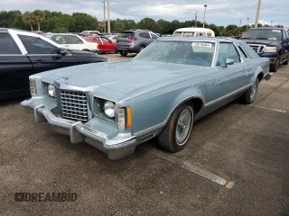 1977 Ford Thunderbird with VIN 7G87S303225, listed as a Copart auction lot 74216404 with 48,305 mi miles and Salvage Title. Bid and sale history available at DreamBid. Image 1.