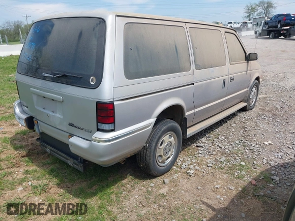 1991 Dodge Grand Caravan with VIN 1B4GK54R6MX632977, listed as a IAAI auction lot 42063934 with 130,812 mi miles and . Bid and sale history available at DreamBid. Image 4.