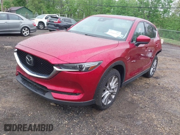 2020 Mazda CX-5 Grand Touring with VIN JM3KFBDM7L1731837, listed as a IAAI auction lot 42160795 with 63,826 mi miles and . Bid and sale history available at DreamBid. Image 2.