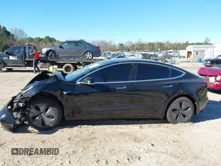2019 Tesla Model 3 Mid Range with VIN 5YJ3E1EA2KF306286, listed as a IAAI auction lot 41699127 with 56,249 mi miles and . Bid and sale history available at DreamBid. Image 14.