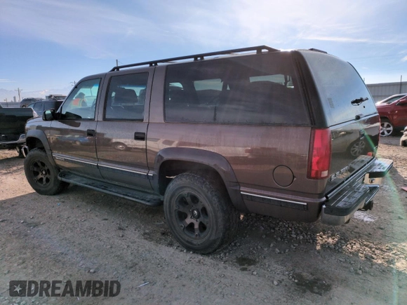 1998 GMC Suburban z VIN 3GKFK16R4WG507685, wystawiony jako Copart lot #87900735 z przebiegiem 183 033 mil mil oraz Szkoda całkowita • Salvage title. Historia ofert i sprzedaży dostępna na DreamBid. Obrazek 2.