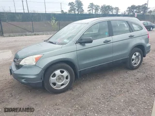 2011 Honda CR-V LX with VIN 5J6RE3H37BL008665, listed as a IAAI auction lot 42060005 with 128,447 mi miles. Bid and sale history available at carsss.com. Image 2.