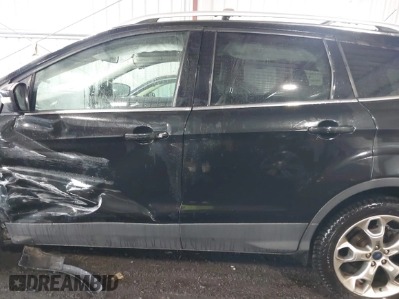 2015 Ford Escape Titanium with VIN 1FMCU9J98FUB00525, listed as a IAAI auction lot 42547989 with 194,040 mi miles and . Bid and sale history available at DreamBid. Image 14.