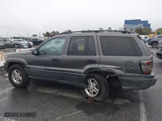 2004 Jeep Grand Cherokee Laredo with VIN 1J4GX48S14C177923, listed as a IAAI auction lot 41745772 with 242,506 mi miles. Bid and sale history available at carsss.com. Image 14.