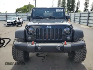2014 Jeep Wrangler Sport with VIN 1C4AJWAG1EL200181, listed as a Copart auction lot 61165595 with 101,234 mi miles and Salvage title. Bid and sale history available at DreamBid. Image 5.