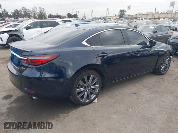2018 Mazda 6 Grand Touring with VIN JM1GL1TY3J1334600, listed as a IAAI auction lot 41060893 with 64,852 mi miles and . Bid and sale history available at DreamBid. Image 4.