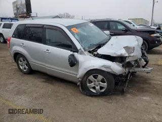 2012 Suzuki Grand Vitara Premium z VIN JS3TD0D66C4100621, wystawiony jako Copart lot #86968164 z przebiegiem Nie podano mil oraz Szkody całkowita. Historia ofert i sprzedaży dostępna na DreamBid. Obrazek 4.