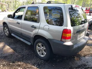 2007 Ford Escape XLT with VIN 1FMCU93167KA51832, listed as a IAAI auction lot 42115125 with 148,584 mi miles. Bid and sale history available at carsss.com. Image 3.