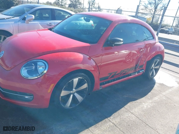 2012 Volkswagen Beetle 2.0T Turbo w/Sun/Sound with VIN 3VWV67ATXCM650376, listed as a IAAI auction lot 41315431 with 104,523 mi miles. Bid and sale history available at carsss.com. Image 6.