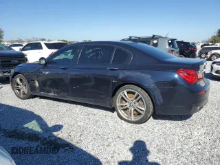 2015 BMW 7 Series 750Li with VIN WBAYE8C51FD781006, listed as a Copart auction lot 48202715 with 50,601 mi miles and Salvage Title. Bid and sale history available at carsss.com. Image 2.