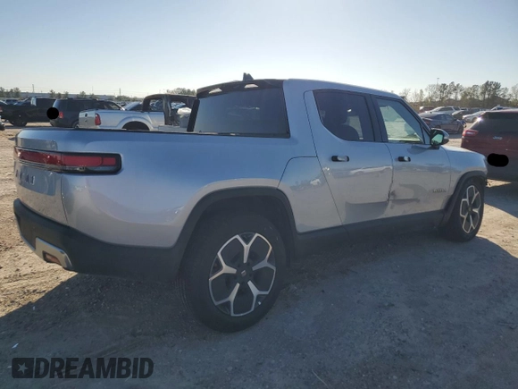 2023 Rivian R1T Adventure with VIN 7FCTGAAA3PN020577, listed as a Copart auction lot 84847414 with 7,888 mi miles and Salvage Title. Bid and sale history available at carsss.com. Image 3.