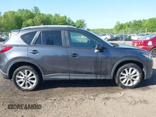 2014 Mazda CX-5 Grand Touring with VIN JM3KE4DY2E0312952, listed as a IAAI auction lot 42138721 with 99,993 mi miles and . Bid and sale history available at DreamBid. Image 13.