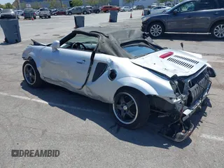2000 Toyota MR2 z VIN JTDFR3207Y0019297, wystawiony jako IAAI lot #42363059 z przebiegiem 80 260 mil mil oraz . Historia ofert i sprzedaży dostępna na DreamBid. Obrazek 3.