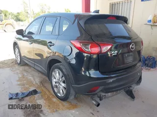 2015 Mazda CX-5 Grand Touring with VIN JM3KE4DY7F0481883, listed as a IAAI auction lot 42091709 with 184,248 mi miles and . Bid and sale history available at DreamBid. Image 3.