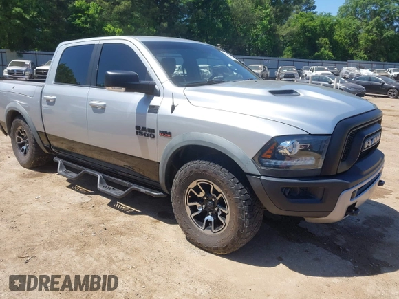 2016 Ram 1500 Rebel z VIN 1C6RR7YT7GS185173, wystawiony jako IAAI lot #42033684 z przebiegiem 152 758 mil mil oraz . Historia ofert i sprzedaży dostępna na DreamBid. Obrazek 1.