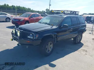 2004 Jeep Grand Cherokee Laredo z VIN 1J4GX48S04C281660, wystawiony jako IAAI lot #42551161 z przebiegiem 173 209 mil mil oraz . Historia ofert i sprzedaży dostępna na DreamBid. Obrazek 2.