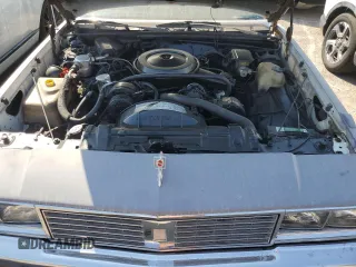 1987 Oldsmobile Cutlass z VIN 2G3GM51Y1H2347545, wystawiony jako Copart lot #76087594 z przebiegiem 98 257 mil mil oraz Szkody całkowita. Historia ofert i sprzedaży dostępna na DreamBid. Obrazek 11.
