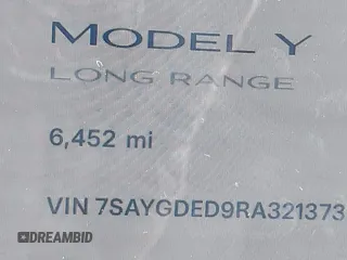 2024 Tesla Model Y with VIN 7SAYGDED9RA321373, listed as a IAAI auction lot 42228491 with 6,452 mi miles and . Bid and sale history available at DreamBid. Image 14.