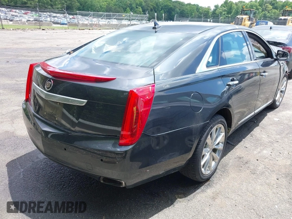 2013 Cadillac XTS Luxury z VIN 2G61P5S34D9109189, wystawiony jako IAAI lot #42242533 z przebiegiem 178 234 mil mil oraz . Historia ofert i sprzedaży dostępna na DreamBid. Obrazek 4.