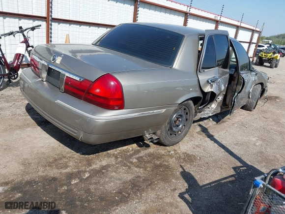 2004 Mercury Grand Marquis GS with VIN 2MEFM74W94X674014, listed as a IAAI auction lot 41973693 with 163,865 mi miles. Bid and sale history available at carsss.com. Image 4.