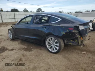2019 Tesla Model 3 Long Range with VIN 5YJ3E1EB1KF212019, listed as a Copart auction lot 50134385 with 83,478 mi miles and Salvage Title. Bid and sale history available at DreamBid. Image 2.