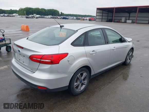 2017 Ford Focus SE with VIN 1FADP3FEXHL283329, listed as a IAAI auction lot 42347751 with 85,337 mi miles and . Bid and sale history available at DreamBid. Image 4.