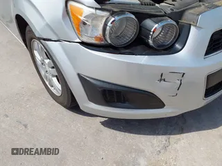 2014 Chevrolet Sonic LT with VIN 1G1JC5SH0E4210327, listed as a IAAI auction lot 42069313 with 94,506 mi miles and . Bid and sale history available at DreamBid. Image 6.