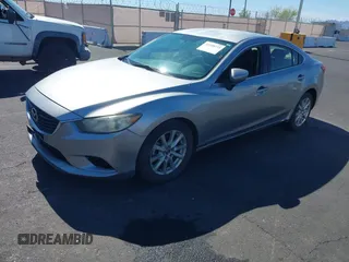 2014 Mazda 6 i Sport with VIN JM1GJ1U61E1151348, listed as a IAAI auction lot 42248173 with 275,764 mi miles and . Bid and sale history available at DreamBid. Image 2.
