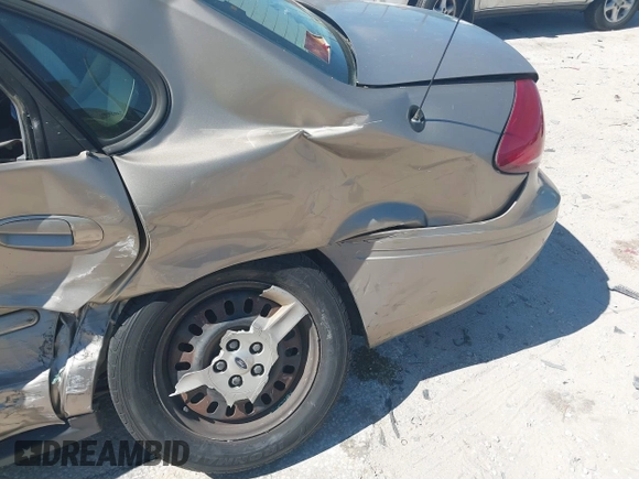 2006 Ford Taurus SE with VIN 1FAFP53U96A223924, listed as a IAAI auction lot 41828443 with 114,653 mi miles. Bid and sale history available at carsss.com. Image 14.