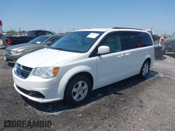 2012 Dodge Grand Caravan SXT with VIN 2C4RDGCG9CR200432, listed as a IAAI auction lot 42027477 with 99,076 mi miles and . Bid and sale history available at DreamBid. Image 2.