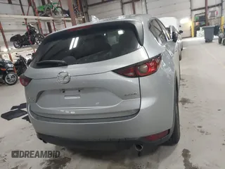 2020 Mazda CX-5 Touring with VIN JM3KFBCMXL0784653, listed as a IAAI auction lot 41817904 with 71,513 mi miles and . Bid and sale history available at carsss.com. Image 16.