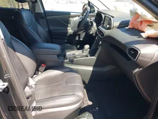2019 Hyundai Santa Fe SE with VIN 5NMS23AD4KH088902, listed as a IAAI auction lot 42044465 with 34,302 mi miles and . Bid and sale history available at DreamBid. Image 5.